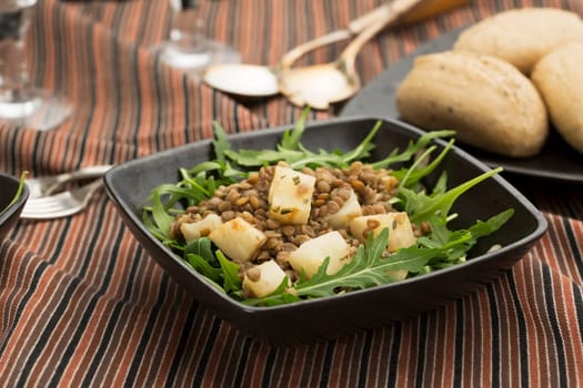 Healthy lentil and celeriac salad on rocket lettuce