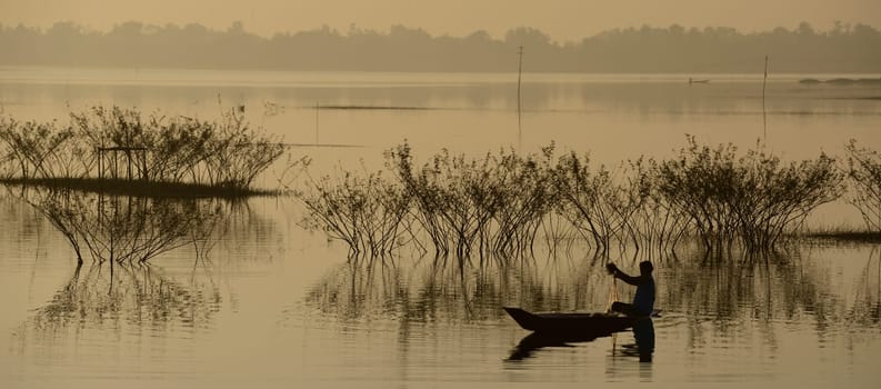 A fisherman on the lake in Amnat Charoen in the Isan in eastern Thailand