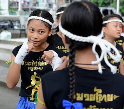 Children at a traditional Thai boxing show at Santichaiprakan Park at Mae Nam Chao Phraya in the capital Bangkok of Thailand in South East Asia.