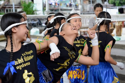 Children at a traditional Thai boxing show at Santichaiprakan Park at Mae Nam Chao Phraya in the capital Bangkok of Thailand in South East Asia.