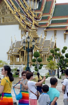 Chinese tourists at the temple complex of Wat Phra Kaew in the capital Bangkok of Thailand in South East Asia.
