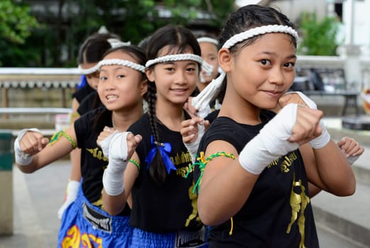 Children at a traditional Thai boxing show at Santichaiprakan Park at Mae Nam Chao Phraya in the capital Bangkok of Thailand in South East Asia.