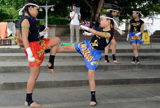 Children at a traditional Thai boxing show at Santichaiprakan Park at Mae Nam Chao Phraya in the capital Bangkok of Thailand in South East Asia.