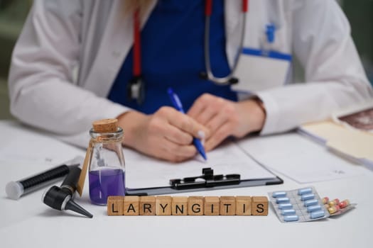 An experienced doctor analyzes laryngitis symptoms with diagnostic tools and notes for effective care