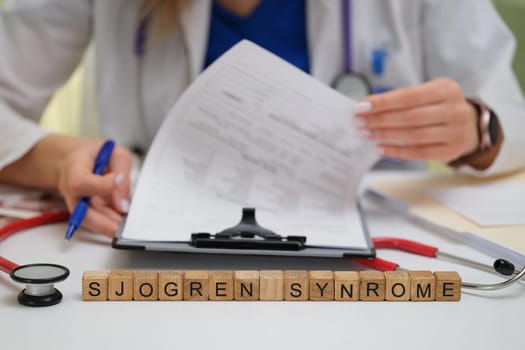 A dedicated healthcare professional actively studying Sjogrens syndrome through detailed patient documents