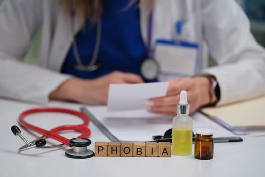A medical professional reviews clinical notes on phobias, highlighting the importance of mental health awareness