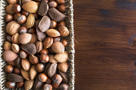 Basket of whole nuts in shell with copy space, can be used vertically or horizontally.