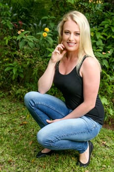Beautiful young blond lady posing outdoors
