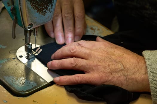 a person whose occupation is making fitted clothes such as suits, pants