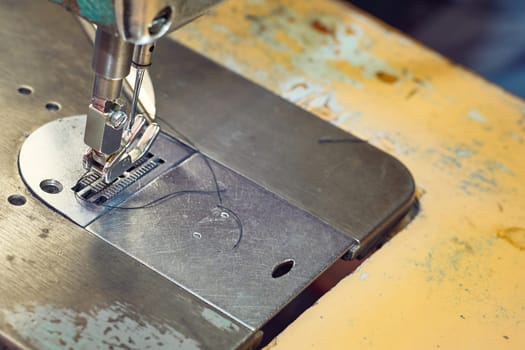 Needle fixing device. the action or activity of sewing. a row of stitches sewn on to clot