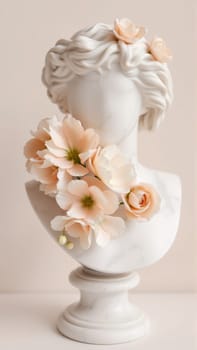 Stone statue covered with spring flowers on isolated background. High quality photo