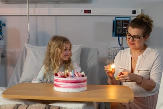 A truly heartwarming and joyous birthday celebration taking place inside a hospital room filled with cake and joy
