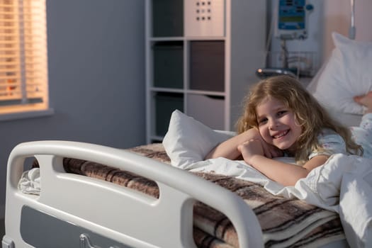 A cheerful girl in a bright, inviting hospital room spreads joy throughout her healing and recovery journey