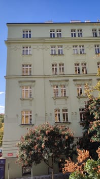 Green building exterior city street outdoor trees architecture windows spring summer day Prague Czech Republic Europe travel places . High quality photo nature