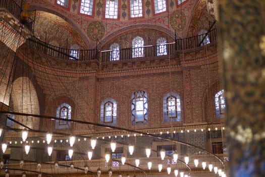 Intricate designs and vibrant colors illuminate the mosque's interior.