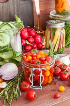 Cann fresh vegetables with herbs and vegetables