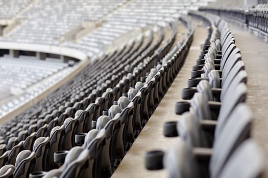 Abstract shot of rows of seating in a sports stadium.
