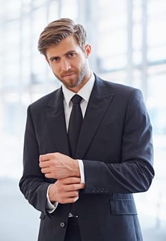 Portrait of a stylish corporate executive smiling confidently at the camera