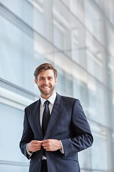 Portrait of a stylish corporate executive smiling confidently at the camera