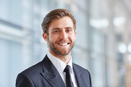 Portrait of a stylish corporate executive smiling confidently at the camera