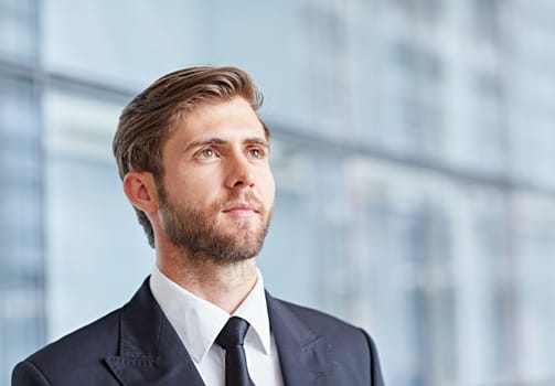 Closeup portrait of a corporate executive looking away confidently and positively
