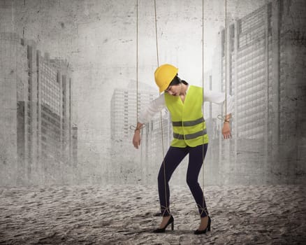 Asian business woman hace string attached on her body like marionette. Business manipulated concept