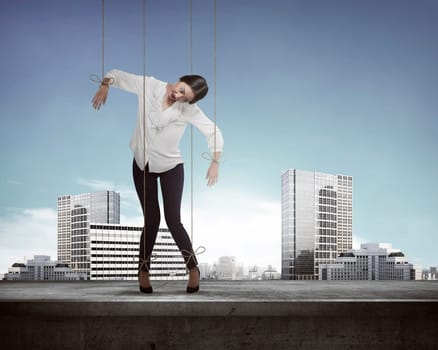 Asian business woman hace string attached on her body like marionette. Business manipulated concept