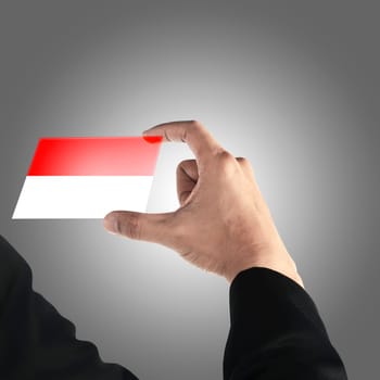 Man hand hold indonesian flag in transparent card