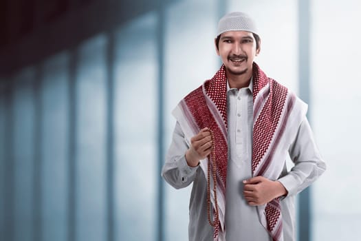 Image of handsome asian muslim man smiling
