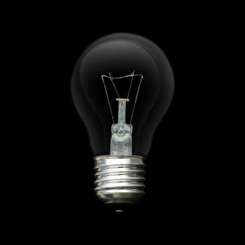 Light bulb isolated on black. Realistic photo image