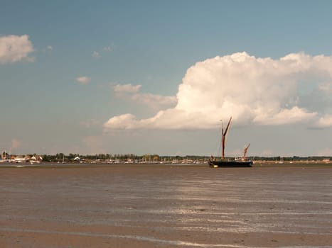 moored sea vessel london barge in black water tide out Maldon Essex  England  UK