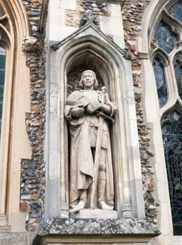 statue of man on the outside of english christian church made of stone Essex  England  UK