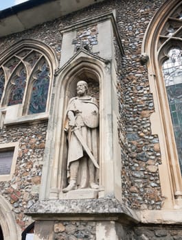 statue of warrior on the outside of english christian church made of stone Essex  England  UK