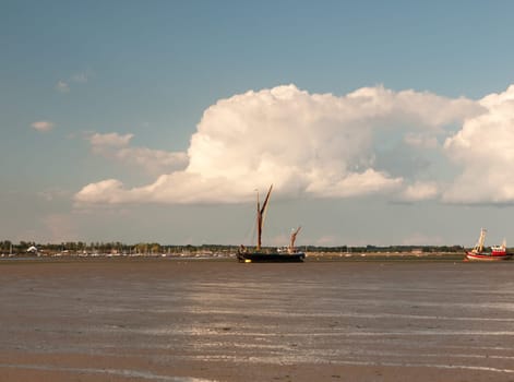 moored sea vessel london barge in black water tide out Maldon Essex  England  UK
