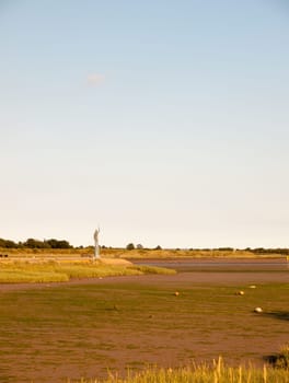 maldon mud flats empty tide out river gone with station at end of walk way without any people on sunny afternoon Essex  England  UK