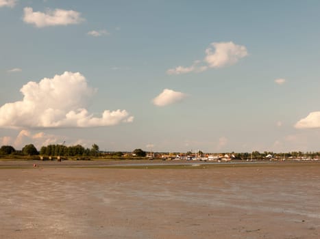 landscape view of maldon docks boats moored across from mudflats with tide out sunny Essex  England  UK