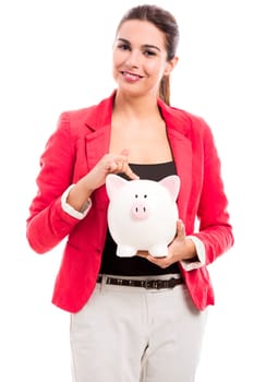 Business woman holding a piggy bank on the hands, isolated over a white background