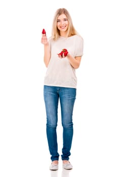 Beautiful blonde woman holding leeks and fighting with them
