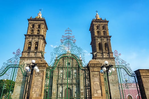 Green gate outside the cathedral in the historic center of Puebla, Mexico