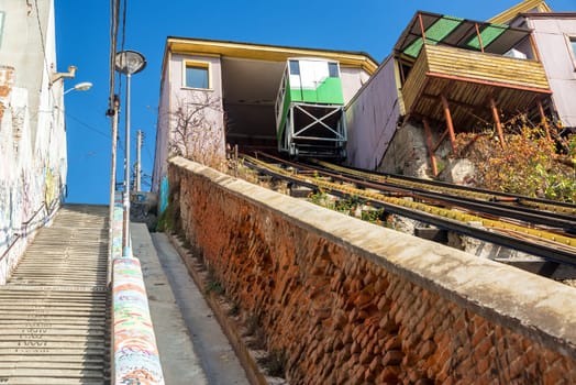 Stairs and a funicular railway going up a hill in Valparaiso, Chile