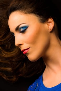 Beauty portrait about woman with blue make-up.