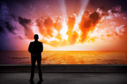 Asian business man looking the cloud on the sea. Business success concept