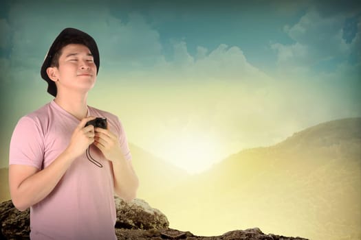 Asian tourist take photo on mountain. Summer holiday concept