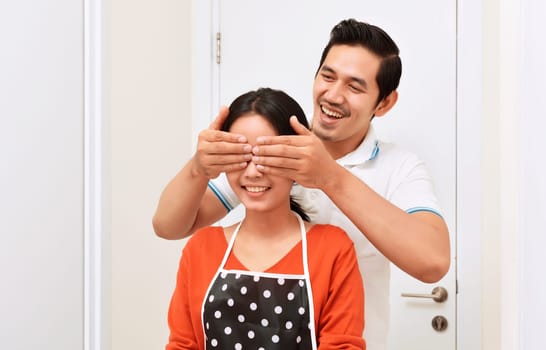 Young asian couple with smile having fun together at home