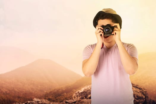 Asian tourist take photo on mountain. Summer holiday concept