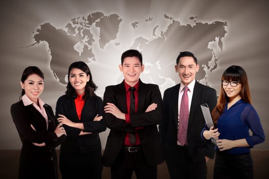 Asian business team with world map background
