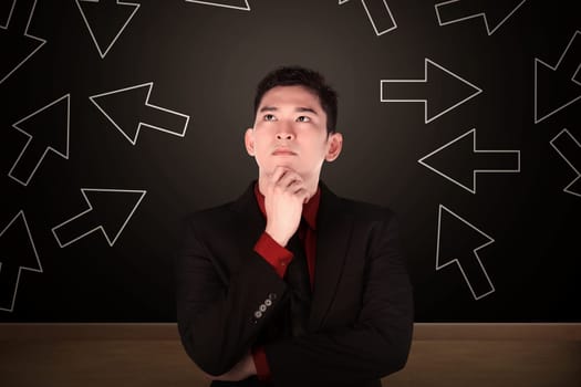 Business man think with arrow shape on the background