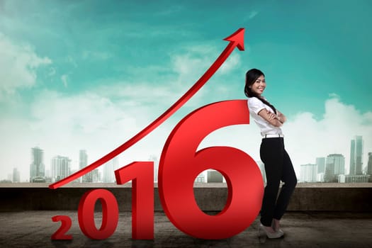 Asian business person lean next to 2016 number. New year resolution concept