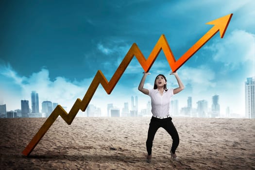 Asian business woman raise up sales chart so its ascending