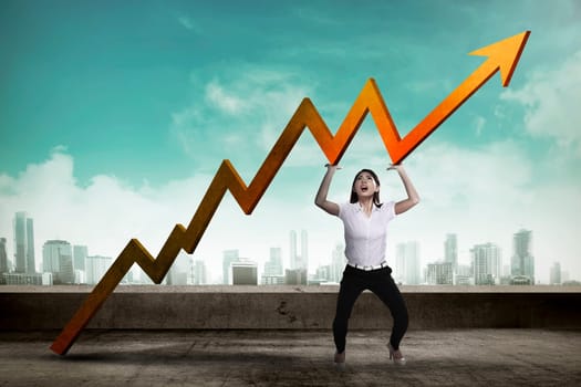 Asian business woman raise up sales chart so its ascending